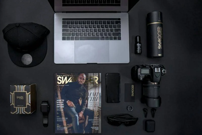 Flat lay of products, camera and laptop for a catalogue shoot
